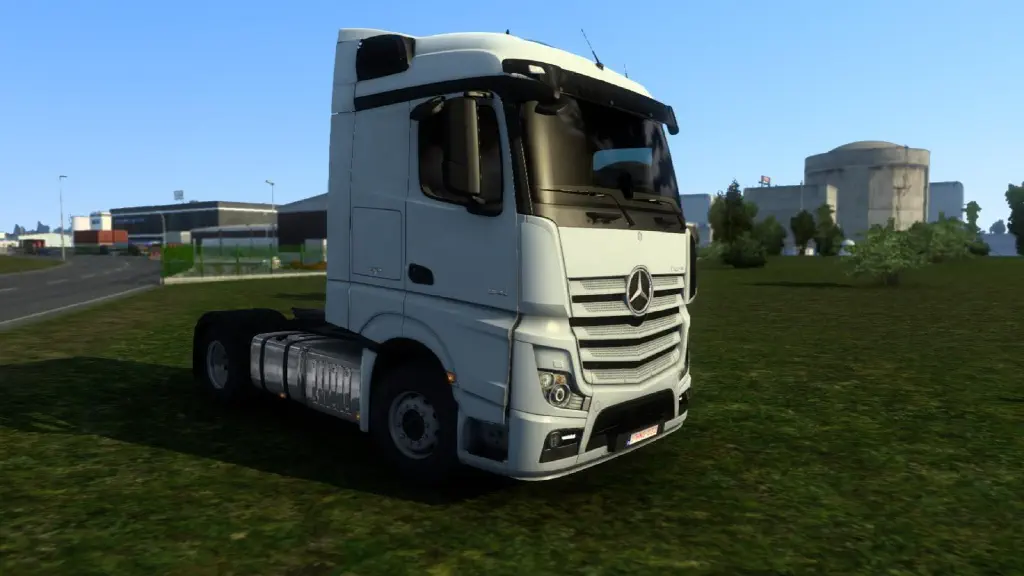in-game screenshot of truck parked on grass