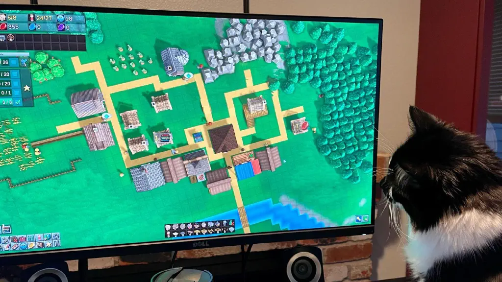 Cat watching gameplay on monitor