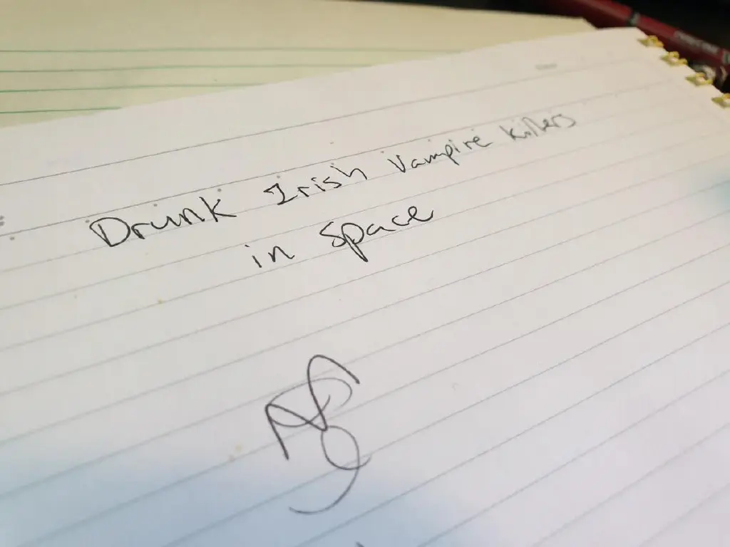 sloppy hand-written text reading &ldquo;Drunk Irish Vampire Killers in Space&rdquo;
