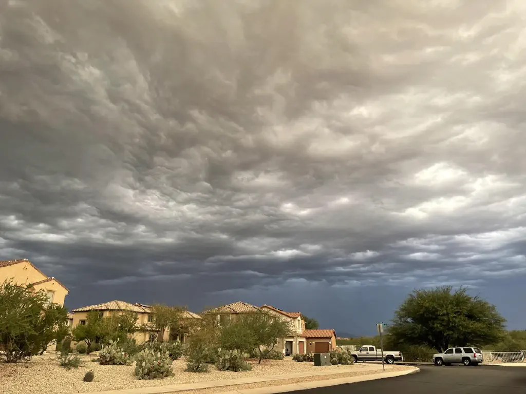Extremely ominous clouds over desert suburban row houses
