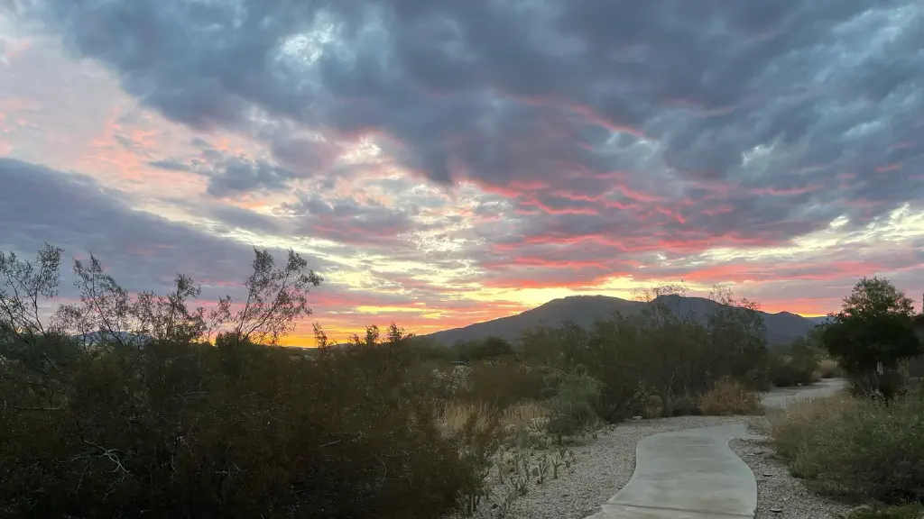 Clouds lit from below by a sun still hiding behind mountains