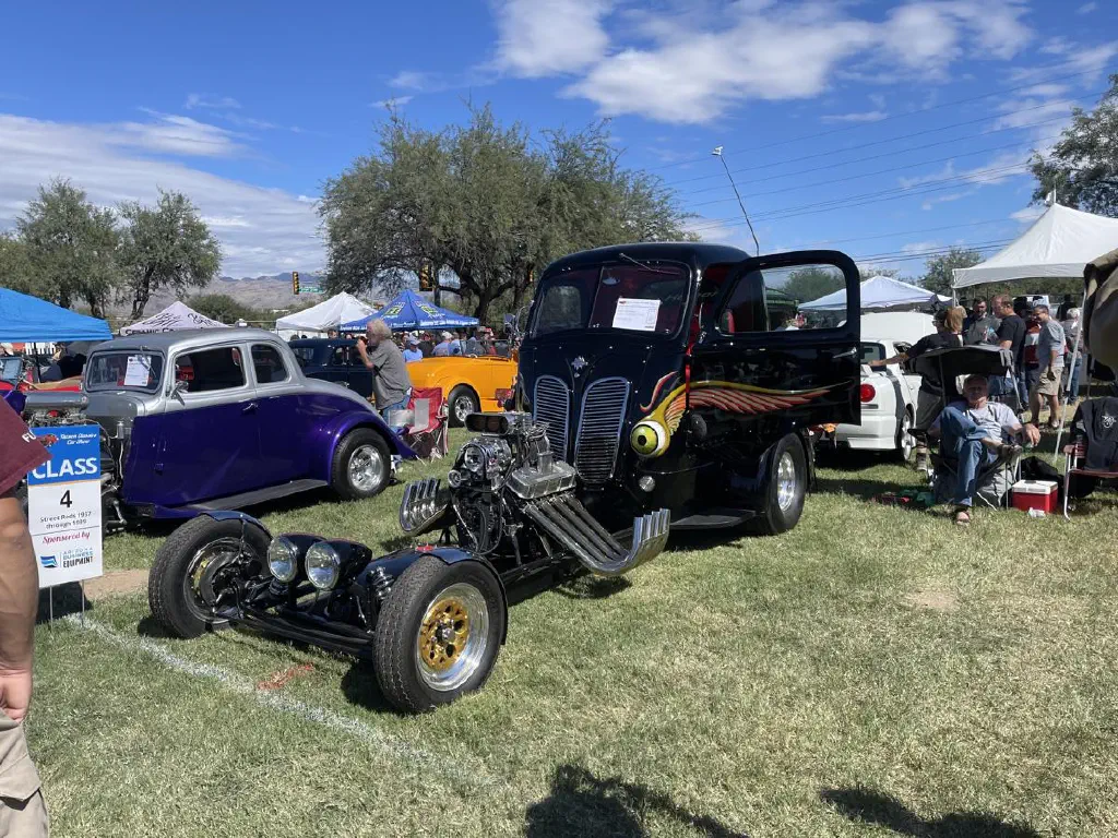 Black drag racer with expose engine and eyeballs on the cab