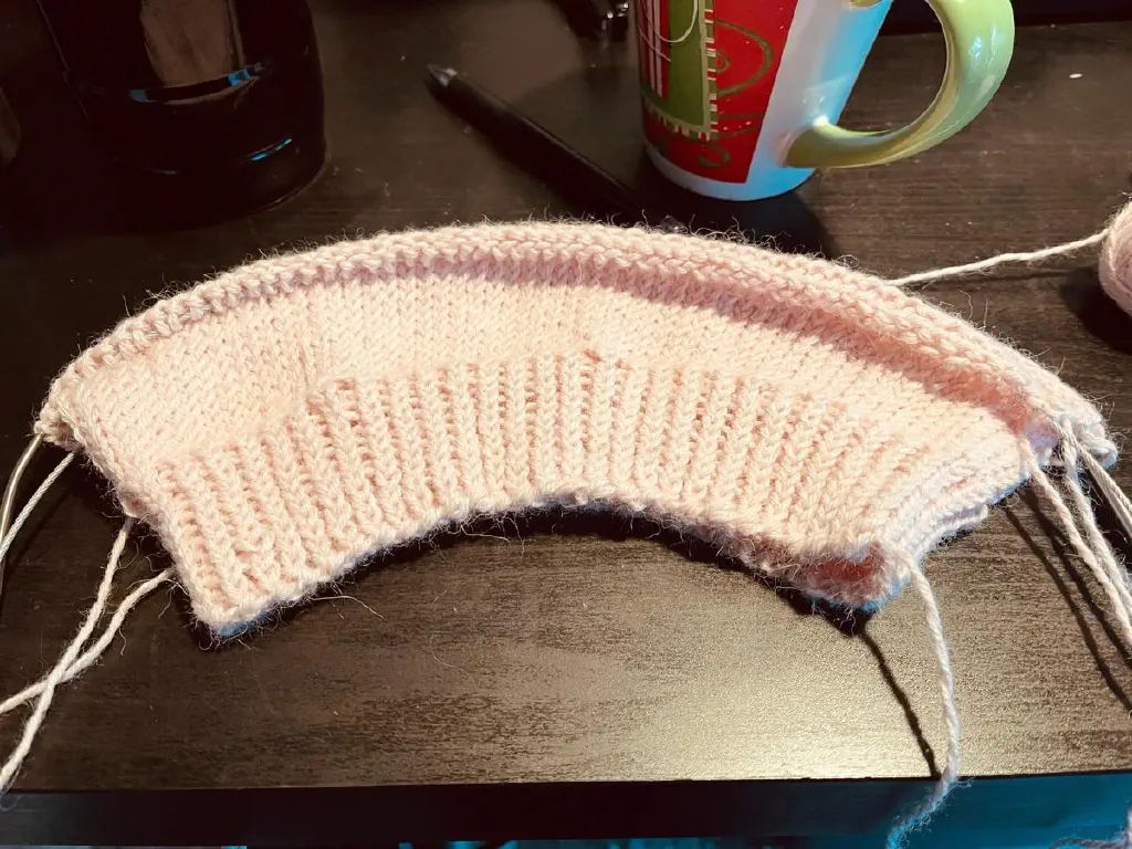 In-progress pink knitted hat