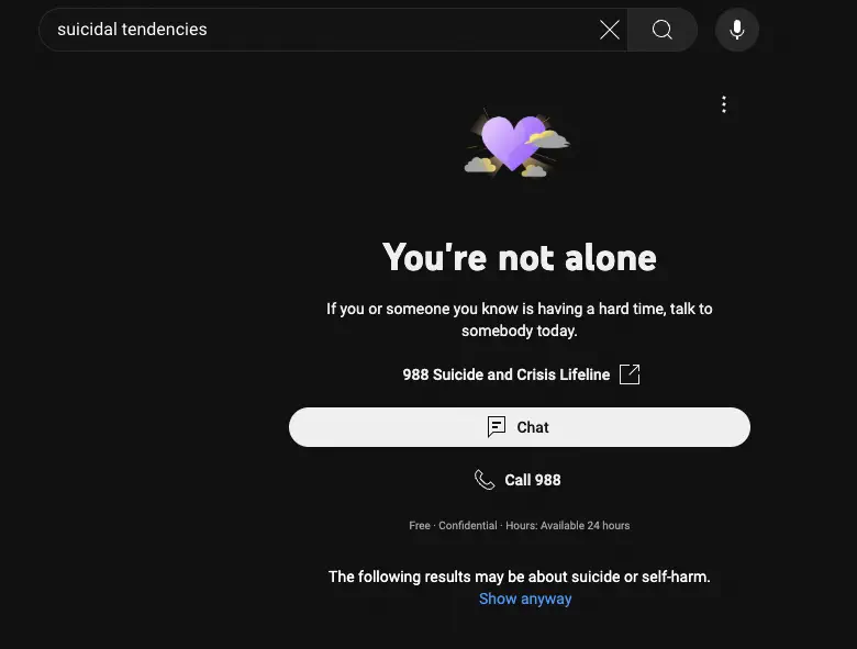 YouTube search for &ldquo;suicidal tendencies&rdquo;; instead of a video list it shows a support splash screen titled &ldquo;You&rsquo;re not alone&rdquo; and with contact links for suicide and crisis lifelines
