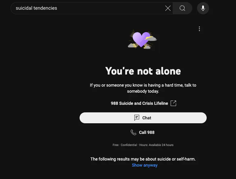 YouTube search for “suicidal tendencies”; instead of a video list it shows a support splash screen titled “You’re not alone” and with contact links for suicide and crisis lifelines