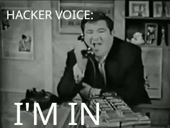 Buddy Hackett on the phone; top caption reads &ldquo;HACKER VOICE:&rdquo;; bottom caption in larger text reads &ldquo;I&rsquo;M IN&rdquo;