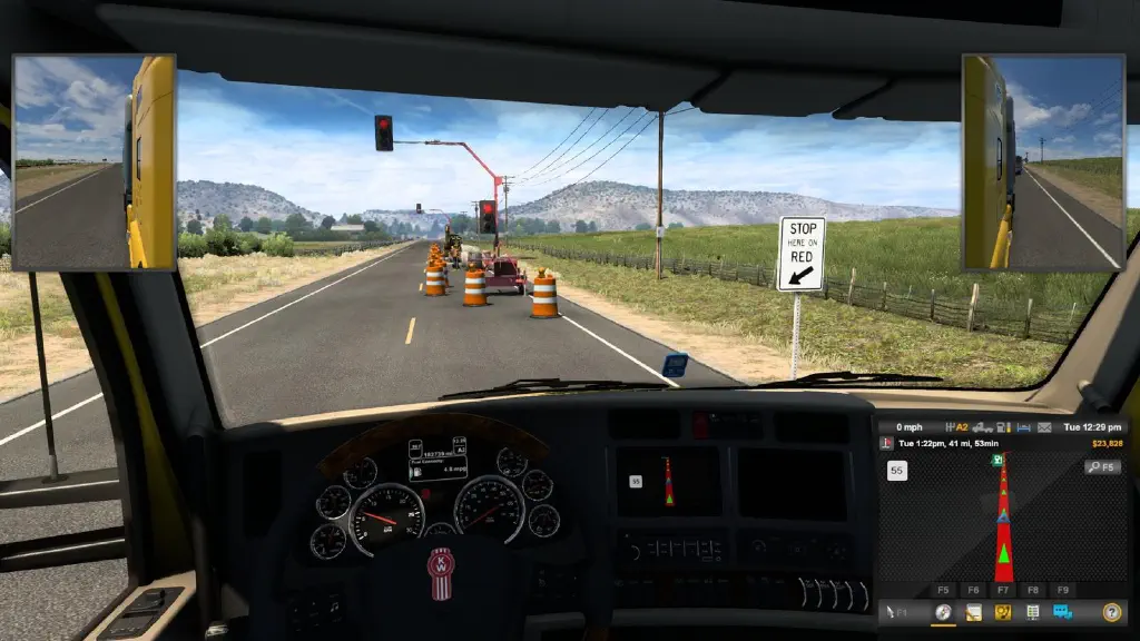 screenshot from driver&rsquo;s seat of truck, waiting for red light to turn green