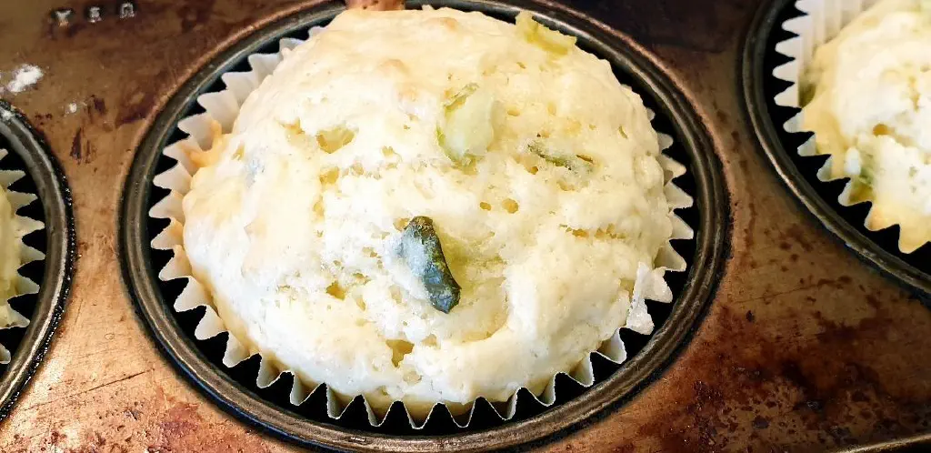 detail view of cooked cupcake with chopped pickle visible in it