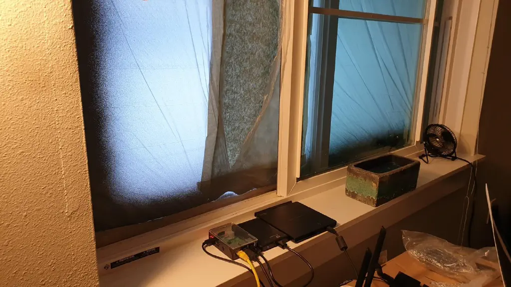 Open window covered on the outside by plastic