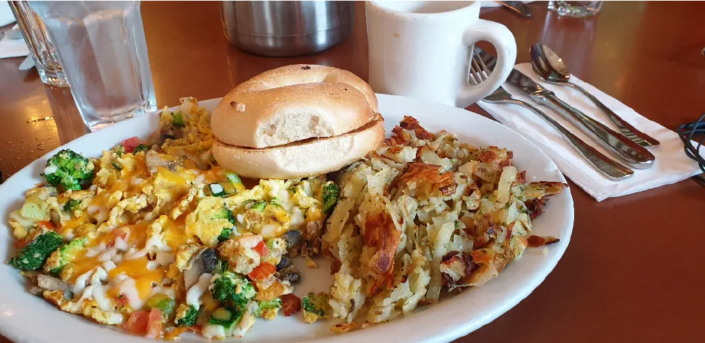 veggie scramble with hash browns and a bagel