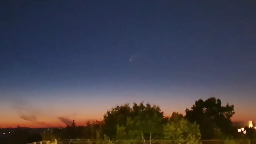 Barely visible comet tail immediately after sunset