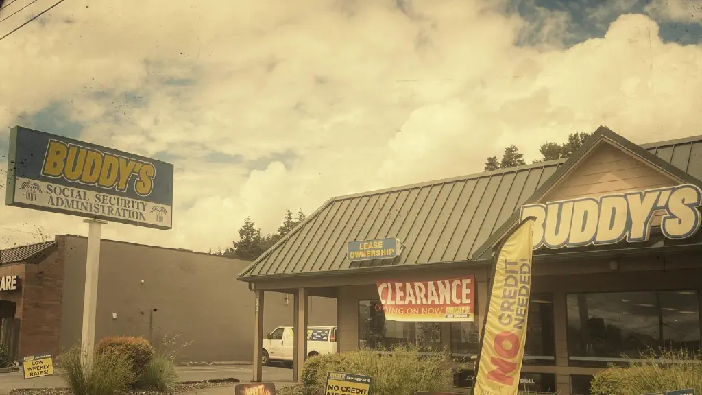 Sign outside of “Buddy’s” furniture rental place says “Buddy’s Social Security Administration”; other signs indicate “clearance” and “no credit needed”