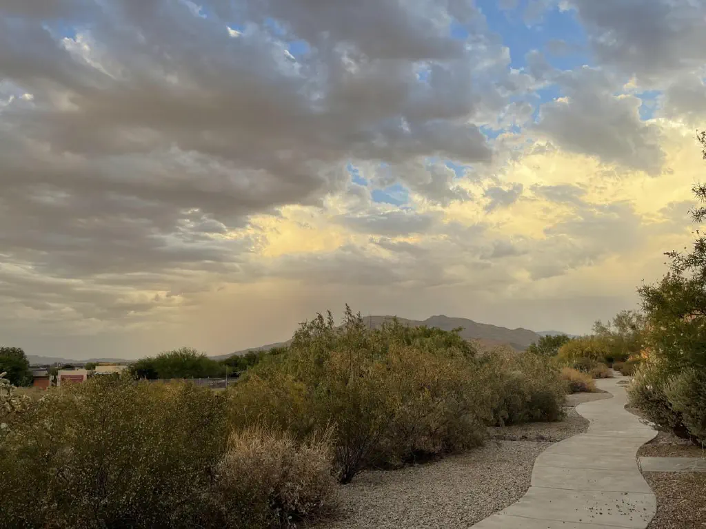 Dramatic clouds over desert mountain skyline