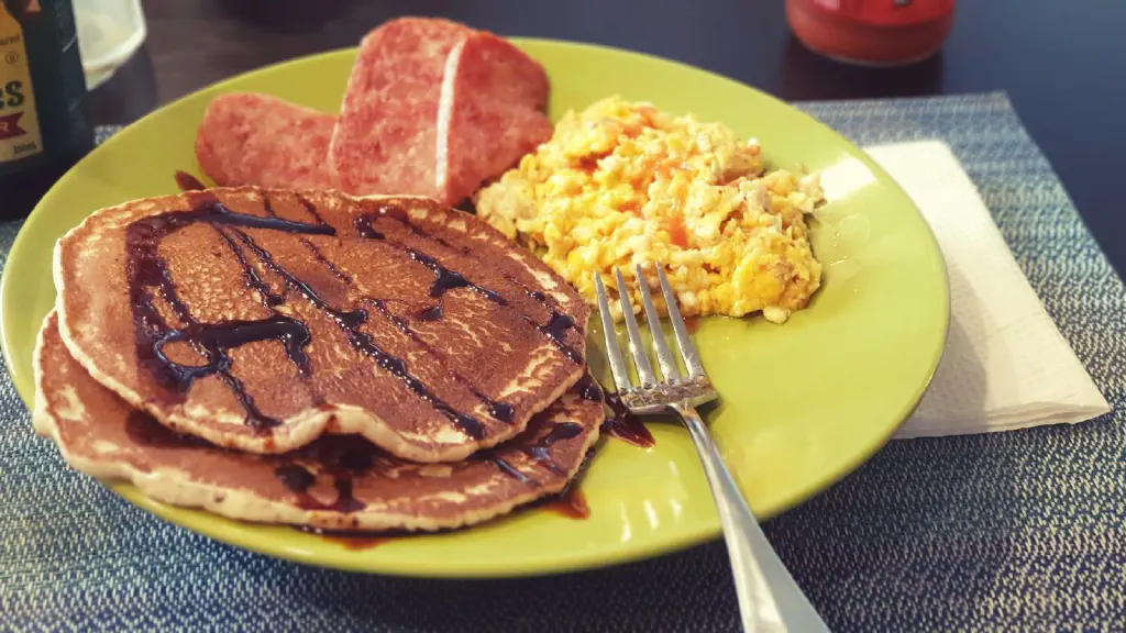 Breakfast: pancakes, cheesy eggs, and fried spam