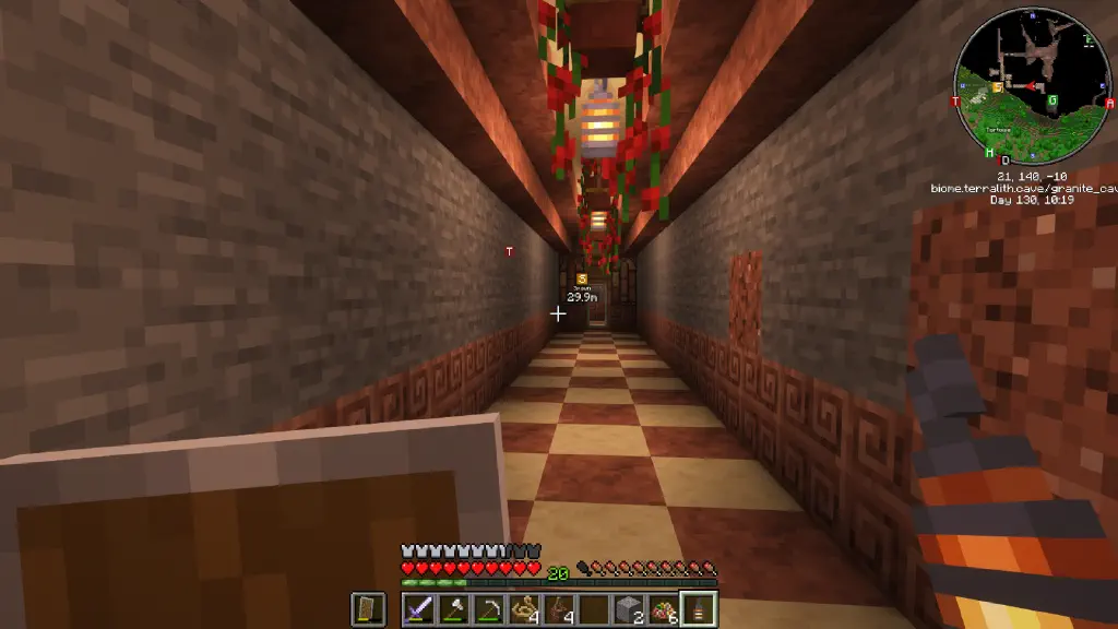 hallway with checkerboard polished granite and smooth sandstone, with lanterns and potted red flowers hanging from the ceiling