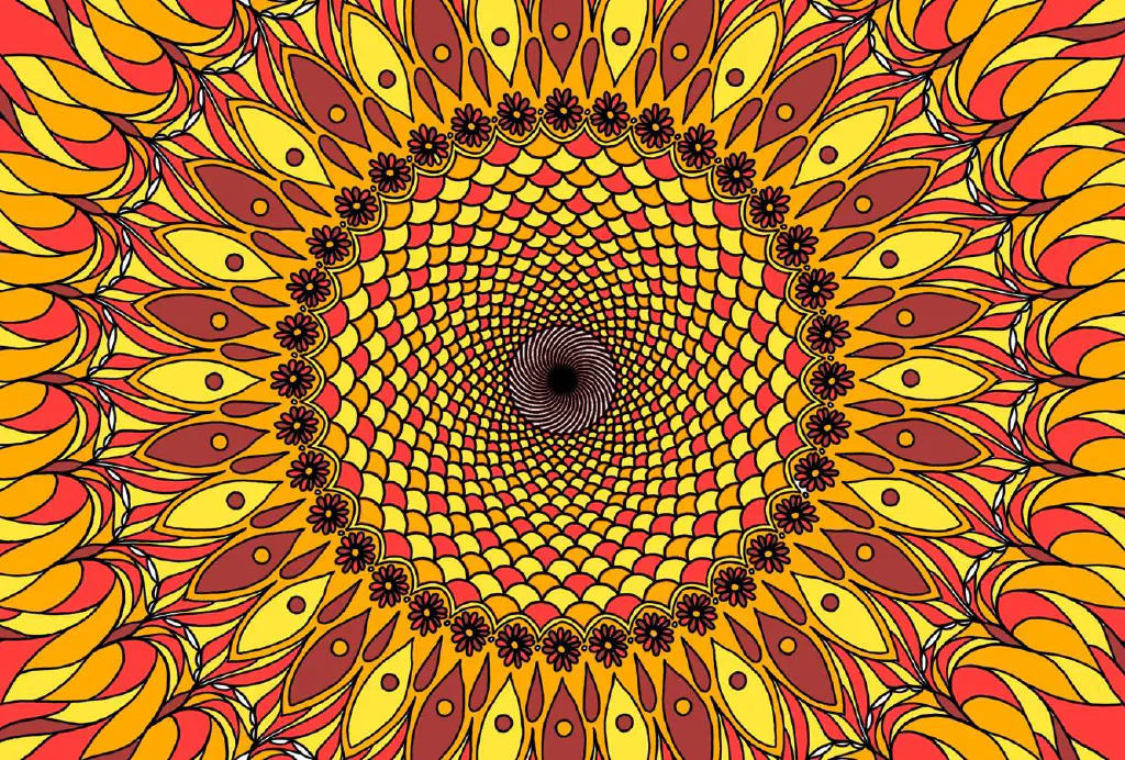 Yellow, orange, and red Kalaidoscopic image looking like a sunburst or sunflower