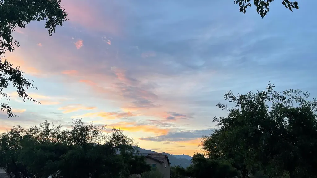 Clouds lit up orange by pre-dawn sun