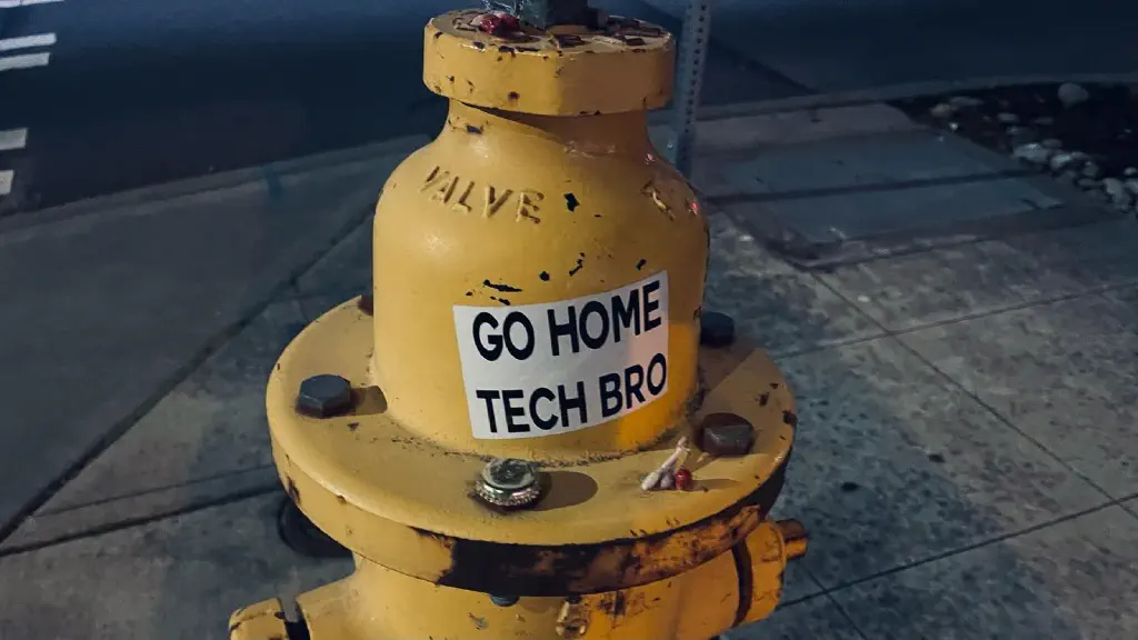 Sticker on fire hydrant; sticker reads “GO HOME TECH BRO”