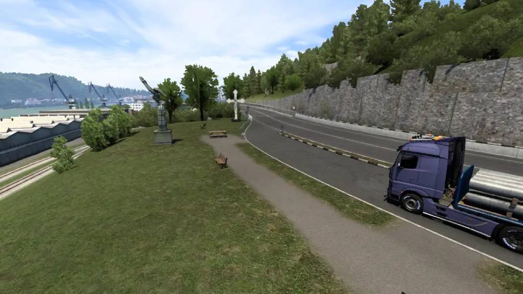 in-game screenshot of viewpoint with Danubia statue in Orsava, with some graffiti on its base and a crucifix behind it