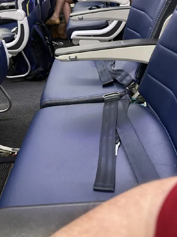 Empty plane seats next to me