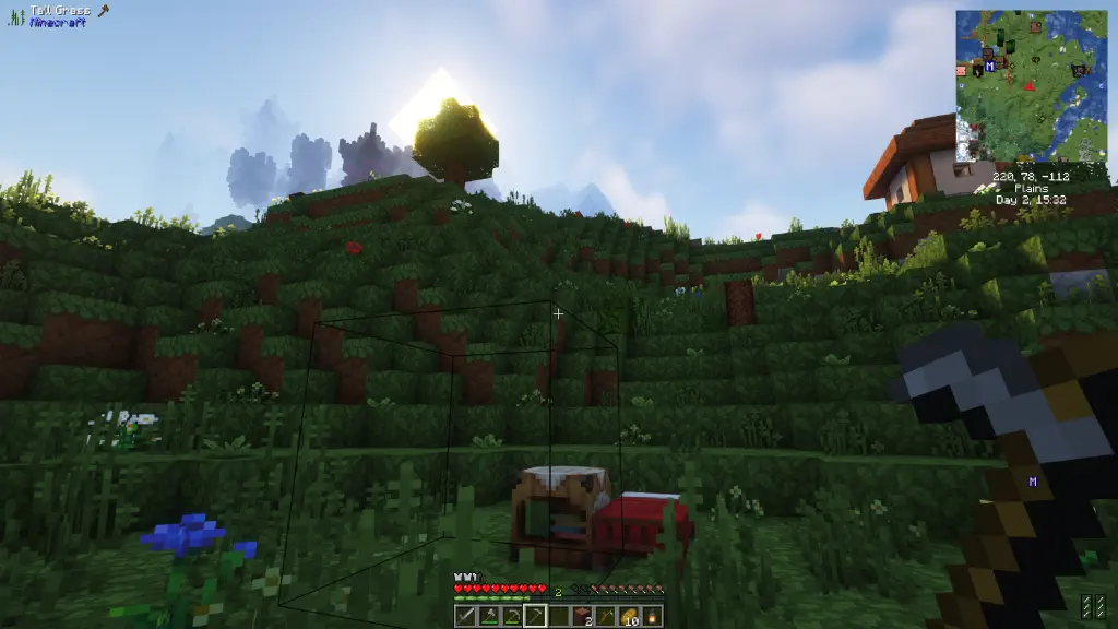 An idyllic green hillside with village nearby and giant ominous keep in the distant background.