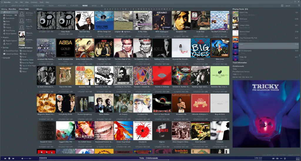 tiled view of album covers with a large album cover view of current playing track