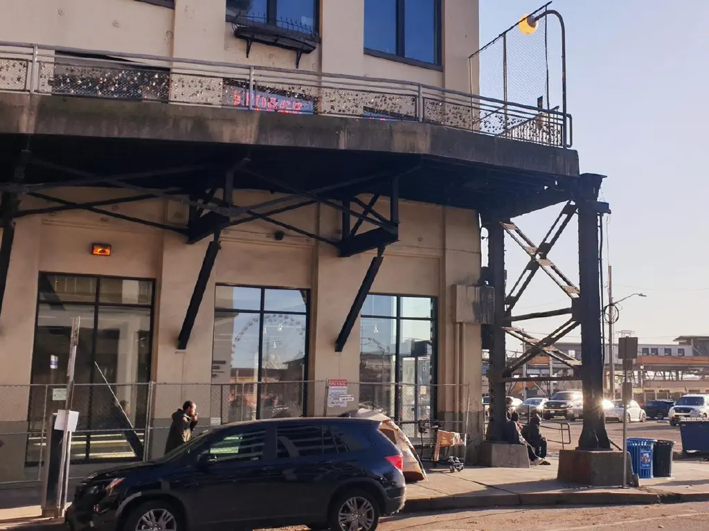 Pedestrian walkway on second floor ends abruptly at building end