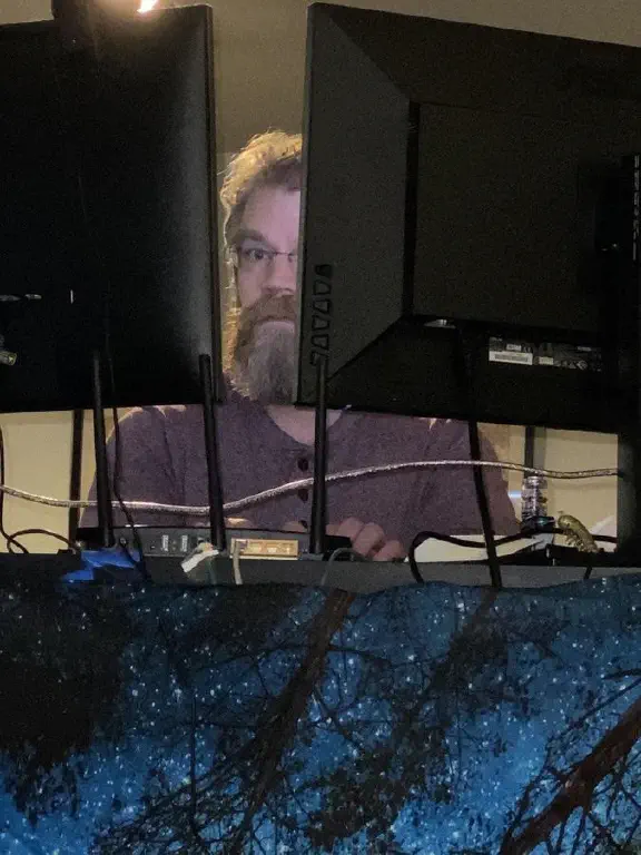 startled geek looking directly at camera