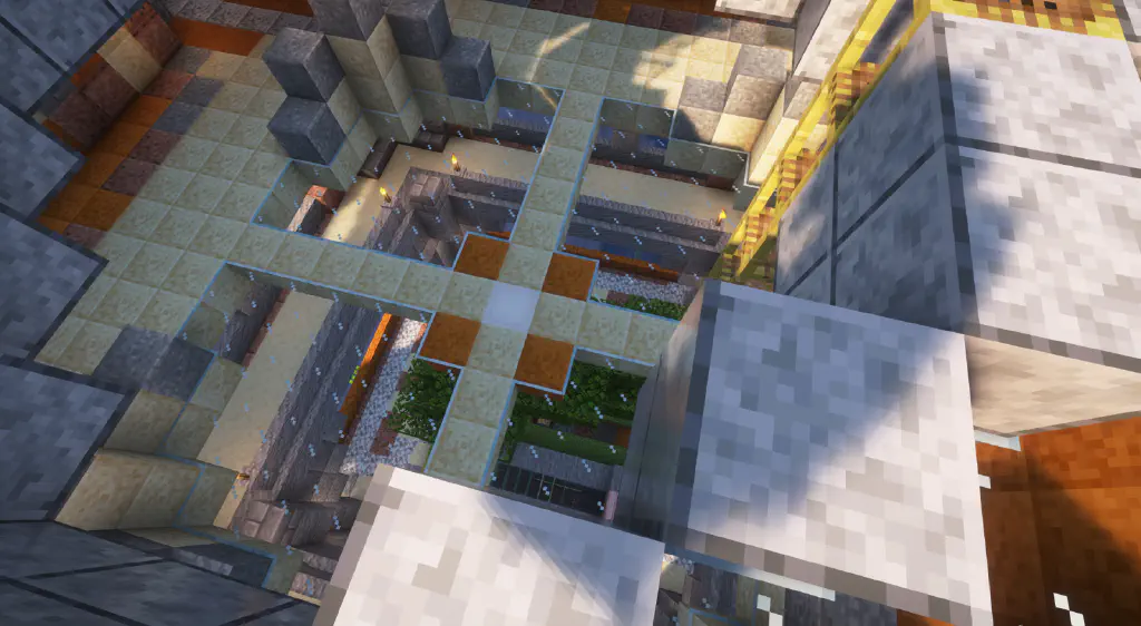 Overhead view of a floor largely consisting of sandstone walkway and glass, the ceiling of the first image