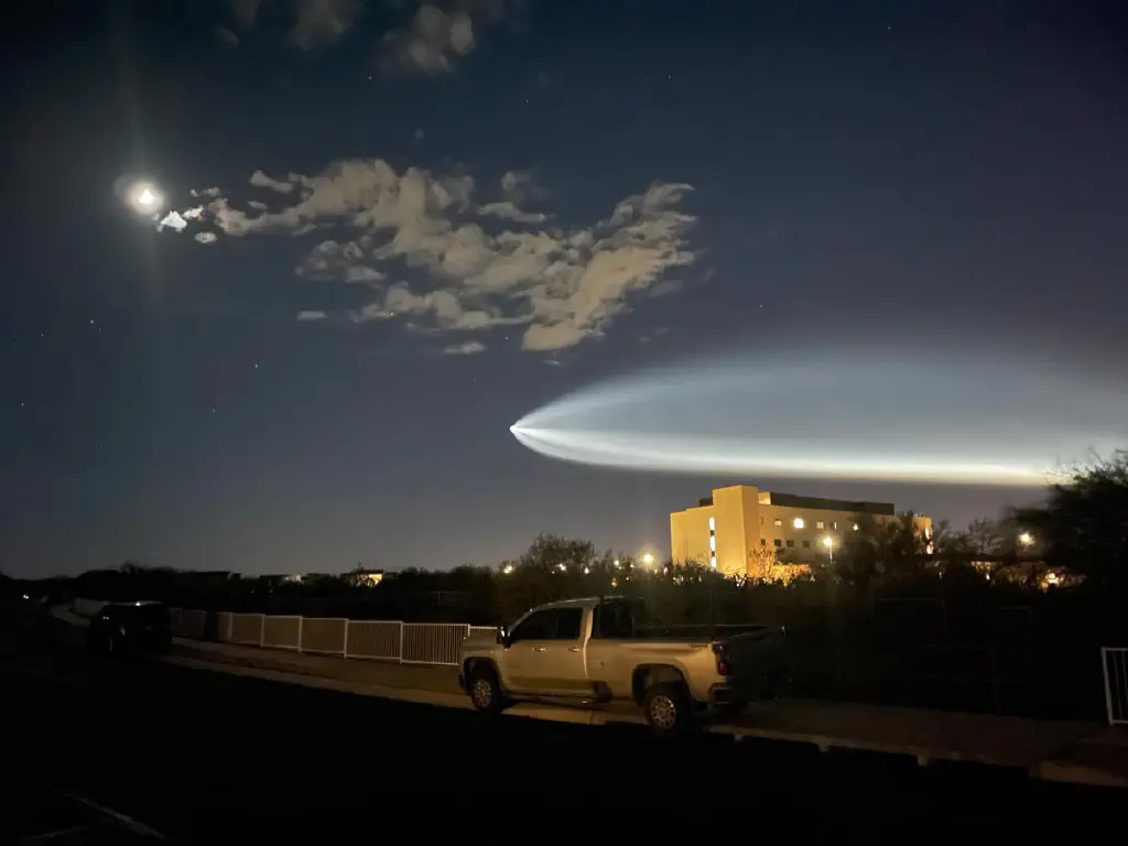 Flaring trail of illuminated gas in the night sky
