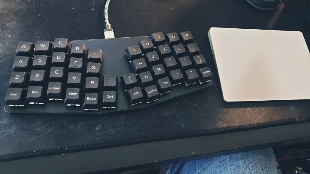 Atreus 44-key keyboard, about the same size as that Apple Magic Trackpad 2 it&rsquo;s next to. 