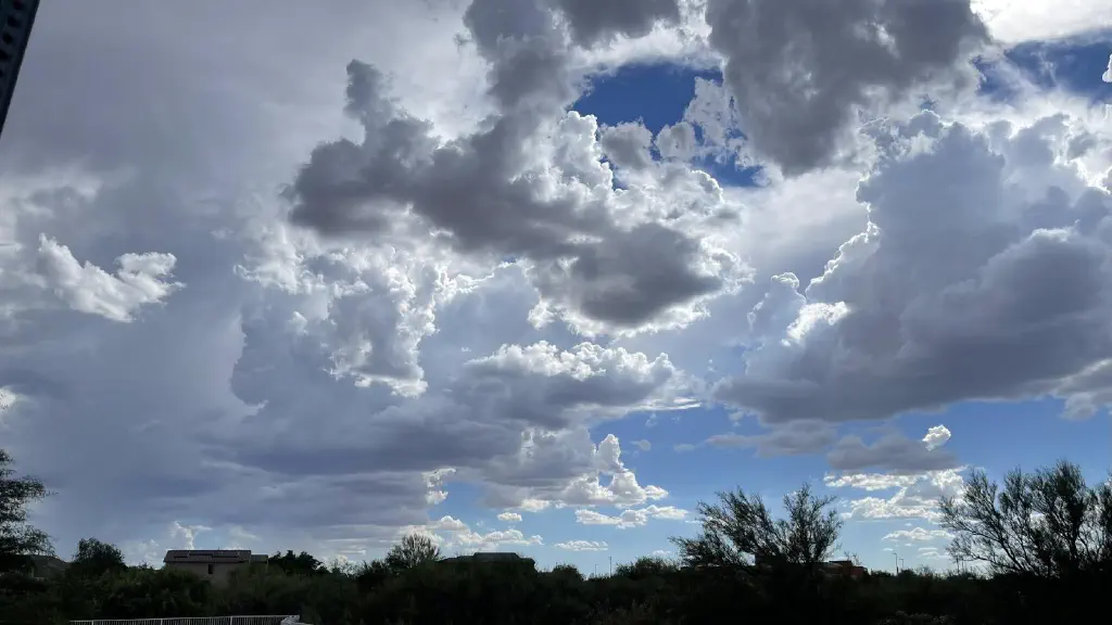 Many clouds against a blue sky, edges brightly lit by sunlight