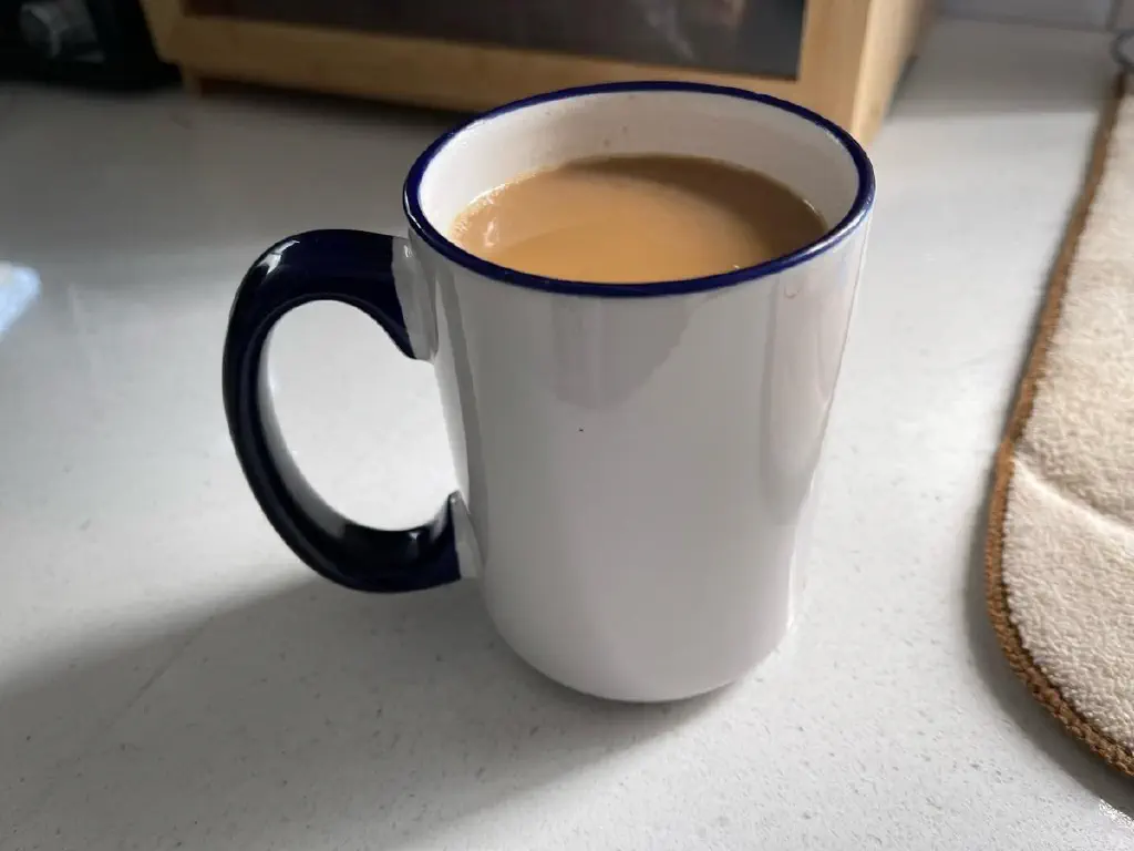 A cup of coffee with cream