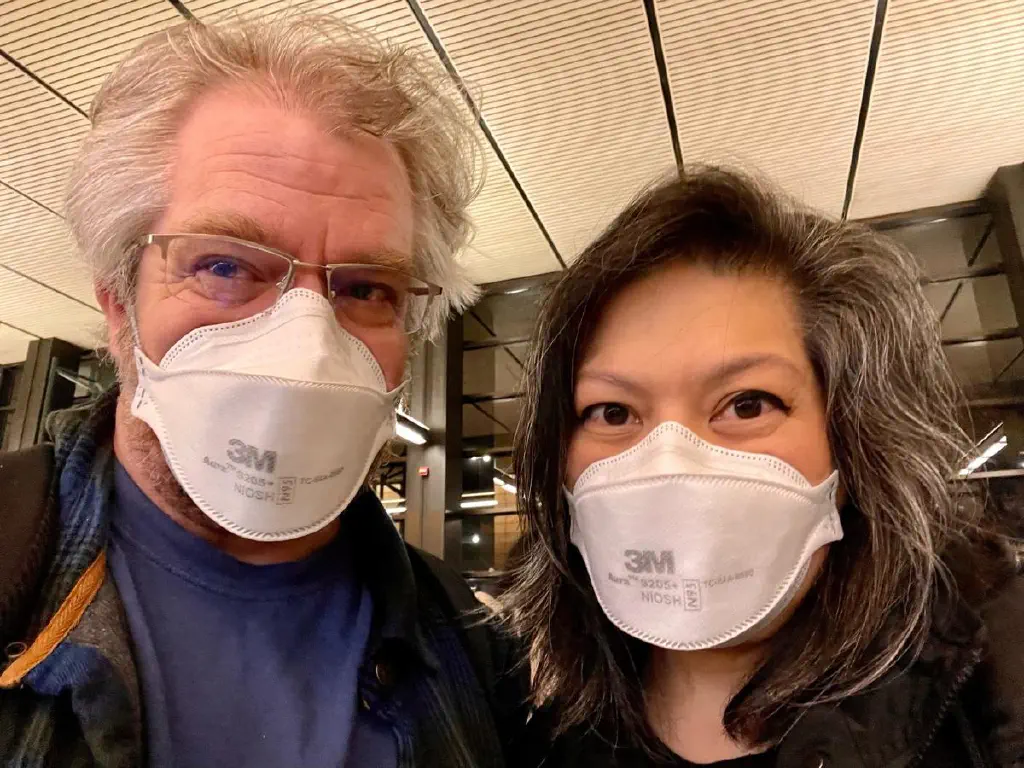 Selfie of cute middle aged couple wearing N95 masks