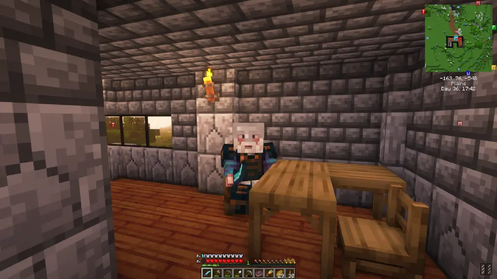 Minecraft block figure with a beard, and blue shirt peeking out from under his armor.