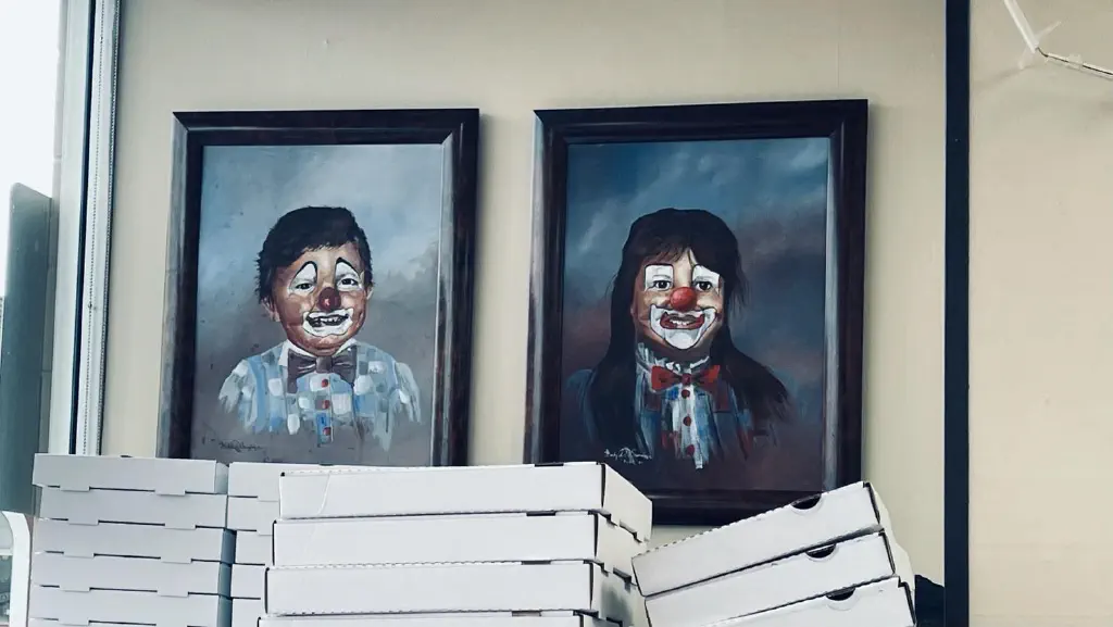 Portrait paintings of children as if they are wearing clown makeup
