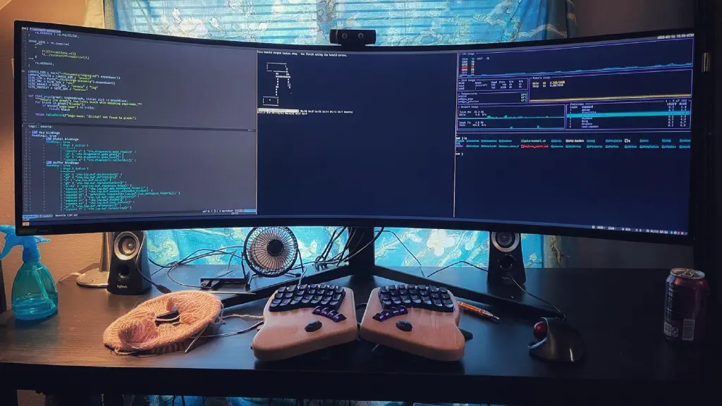 Ridiculously large curved monitor occupied by a full screen terminal divided into three columns: neocon, nethack, and gotop