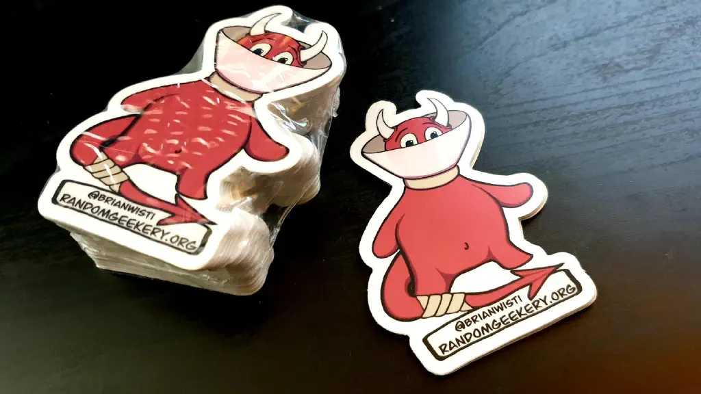 Small pile of stickers with my Twitter handle and site URL