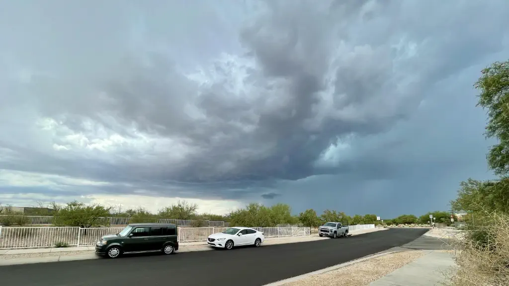Heavy cloud line approaching with clearly defined cloud boundaries on one side and threatening grey all the way to the ground on the other. 