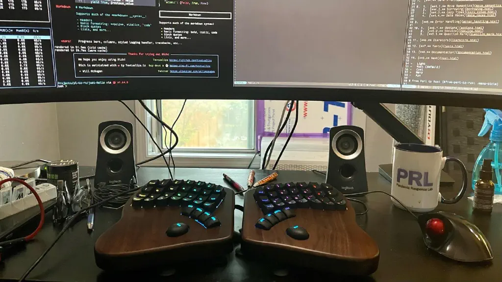 A split keyboard under a ridiculously wide monitor.
