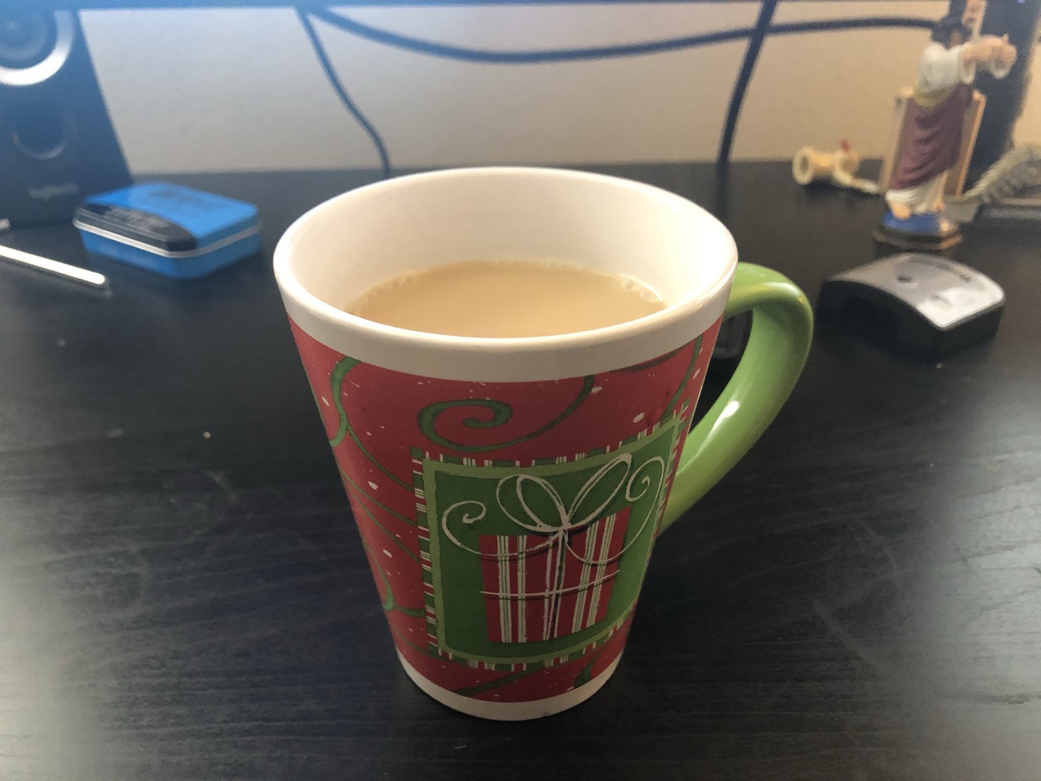 Coffee cup with image of Christmas present on it