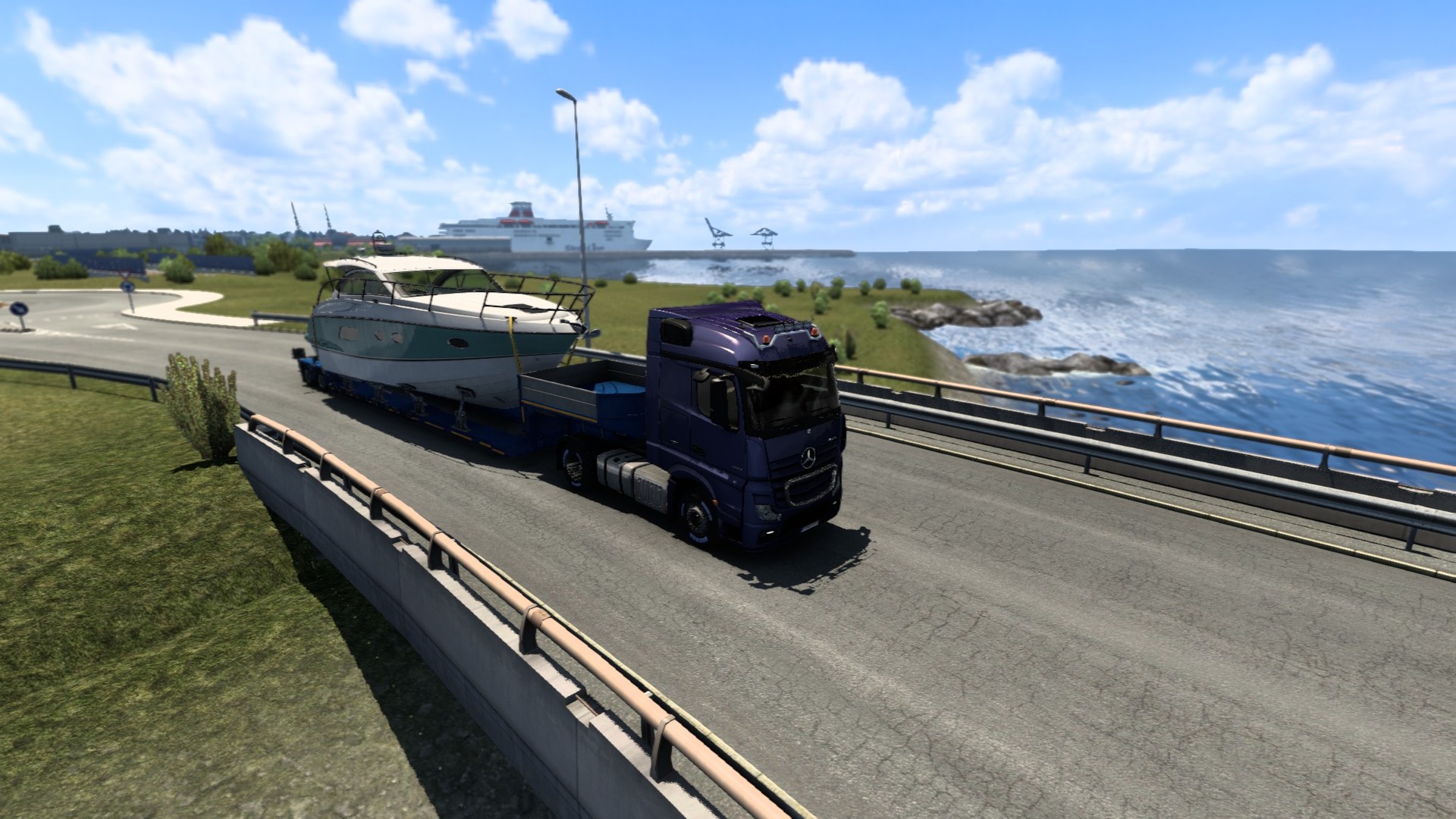 Game screenshot of truck pulling a yacht with blue sky and ocean behind