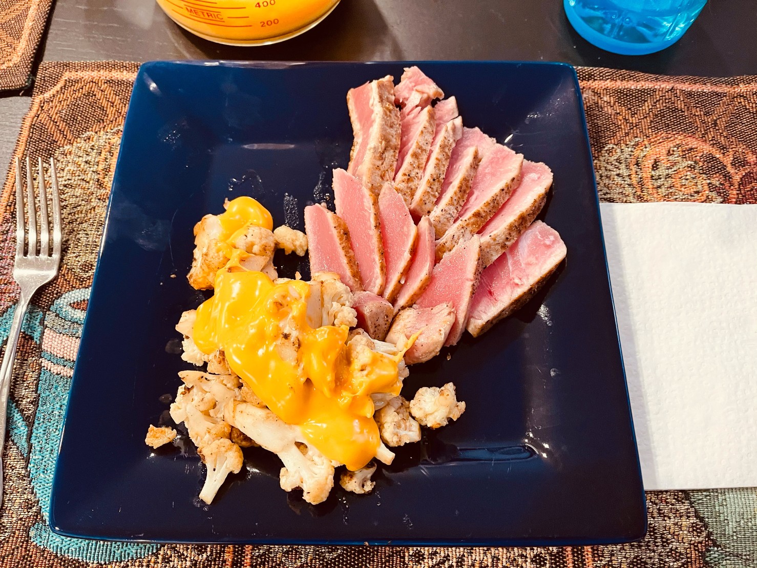 Seared tuna and roasted cauliflower, with cheese sauce on the cauliflower