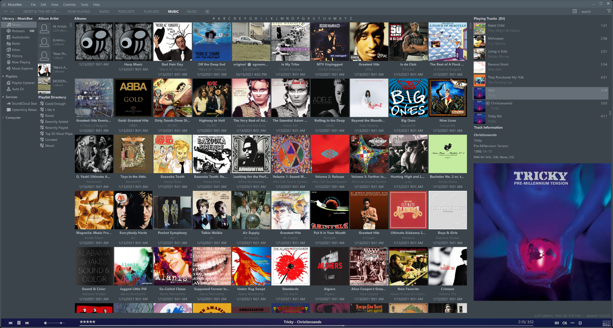 tiled view of album covers with a large album cover view of current playing track