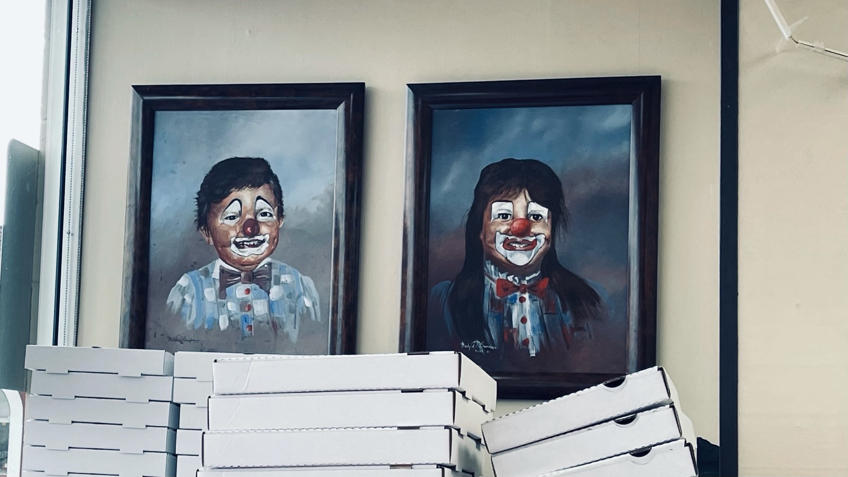 Portrait paintings of children as if they are wearing clown makeup