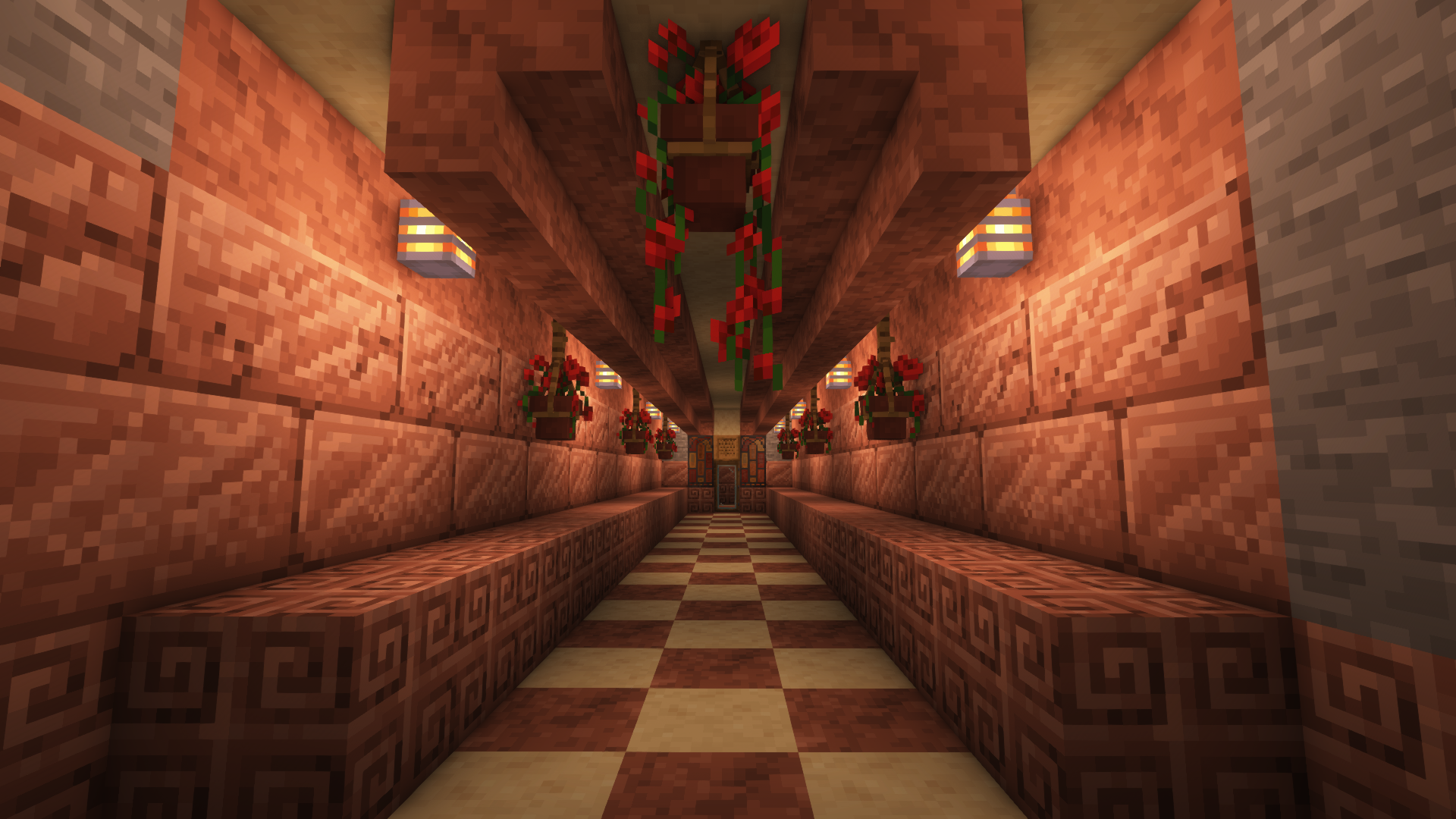 Tunnel with tiled floor and decorative walls using granite and sandstone, recessed lighting, hanging flower pots containing red poppies; tunnel ends at glass door surrounded by stained glass